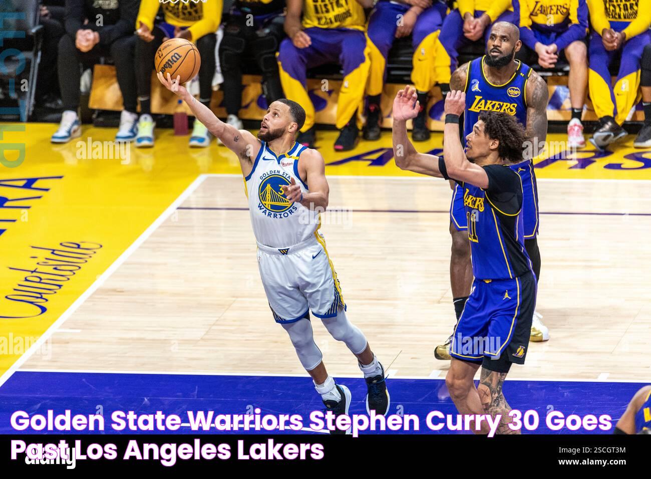 Golden State Warriors' Stephen Curry 30 goes past Los Angeles Lakers